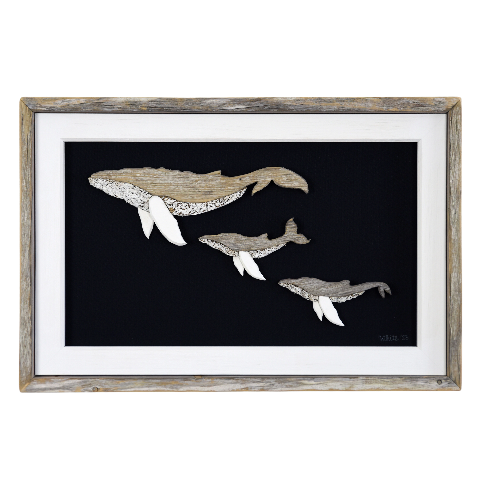 The White's Emporium's driftwood art piece features three humpback whales, a mother and 2 calves, made from reclaimed wood and driftwood sourced in Newfoundland.