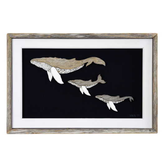  The White's Emporium's driftwood art piece features three humpback whales, a mother and 2 calves, made from reclaimed wood and driftwood sourced in Newfoundland. 