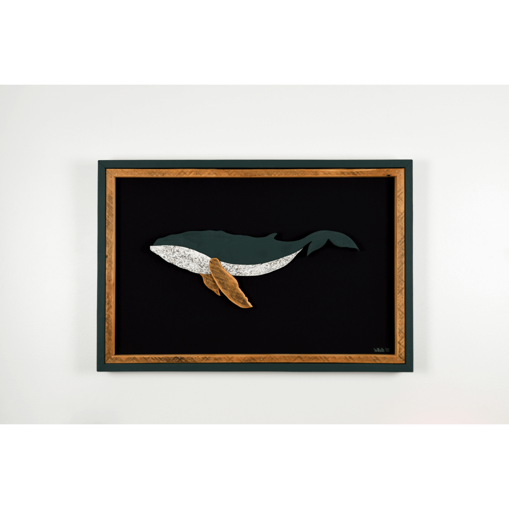 The Humpback showcases a humpback whale made from reclaimed wood and driftwood with green exterior frame, brown tone wood interior trim and fins, and a black canvas.