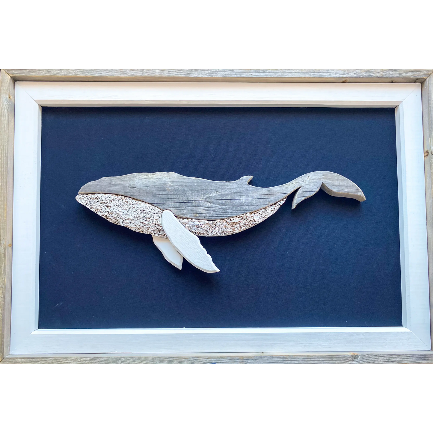 "The Humpback" by The White's Emporium is a mixed media artwork made from various woods and fabric featuring a humpback whale.
