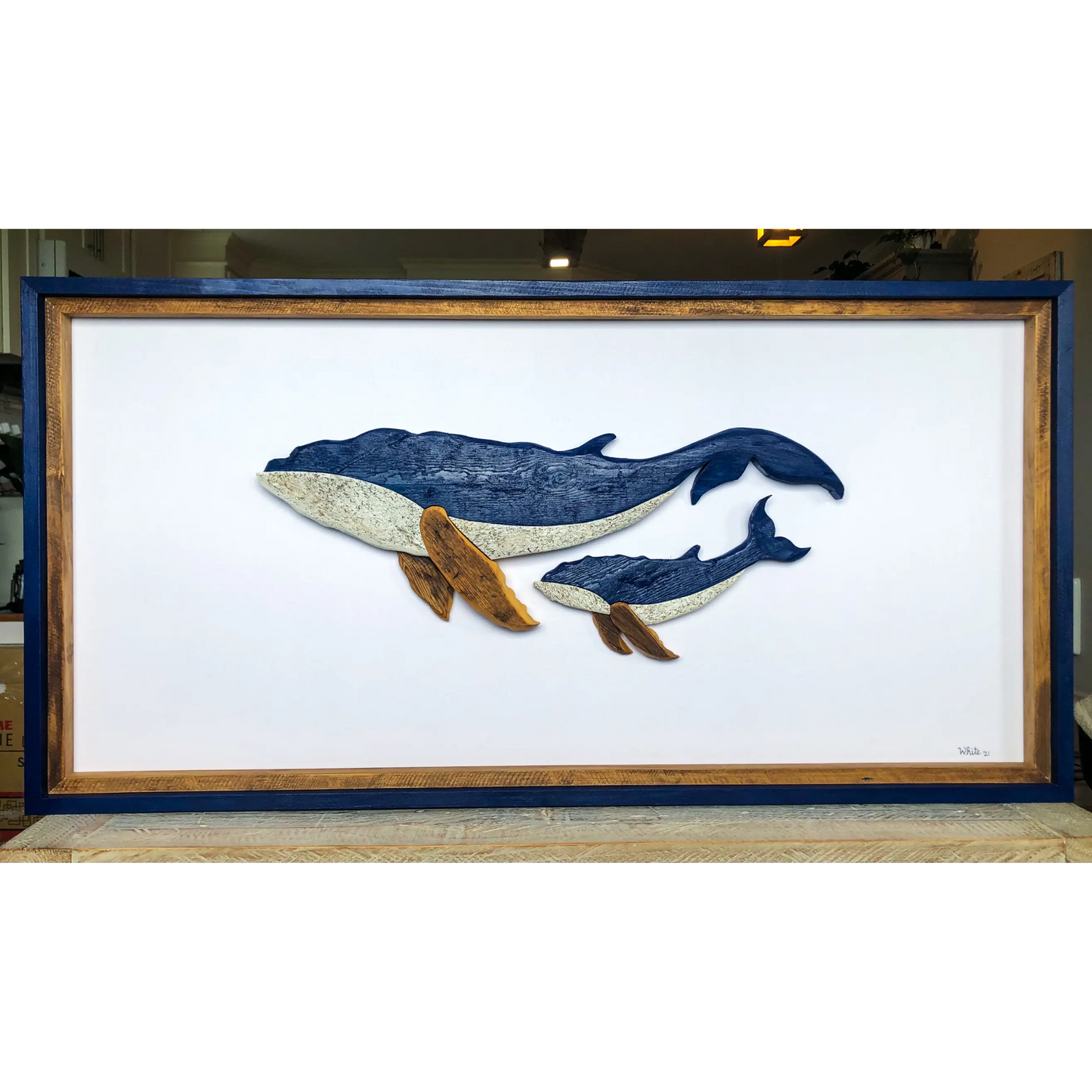 The White's Emporium's "The Mother- Water Street Series" driftwood art piece features two humpback whales made from reclaimed wood and driftwood sourced in Newfoundland.