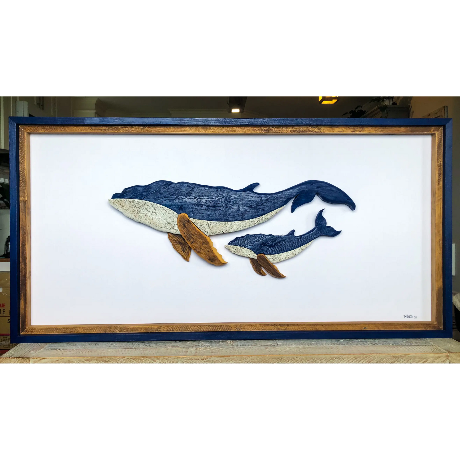 The White's Emporium's "The Mother- Water Street Series" driftwood art piece features two humpback whales made from reclaimed wood and driftwood sourced in Newfoundland.
