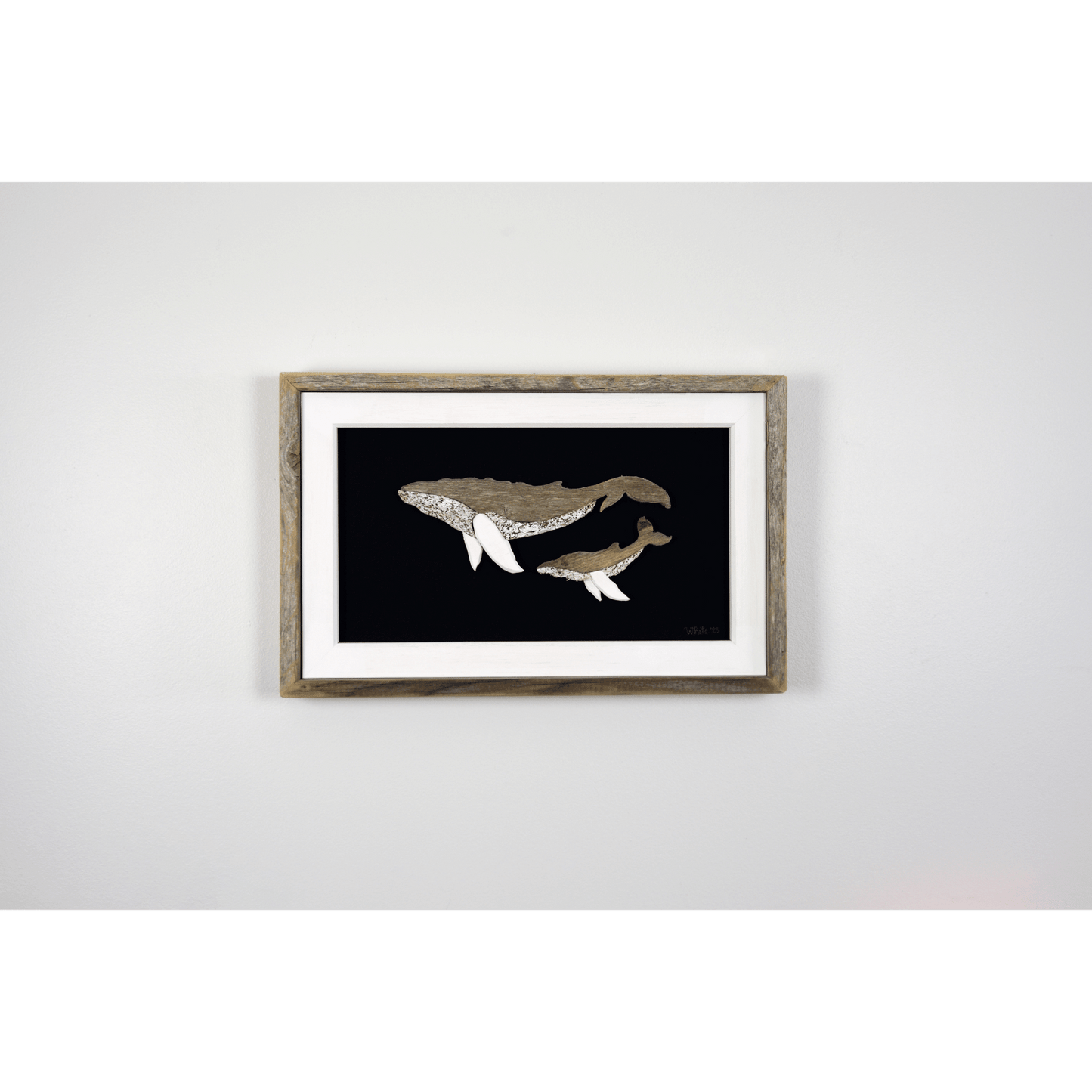 The White's Emporium's "The Mother" driftwood art piece features two humpback whales made from reclaimed wood and driftwood sourced in Newfoundland.