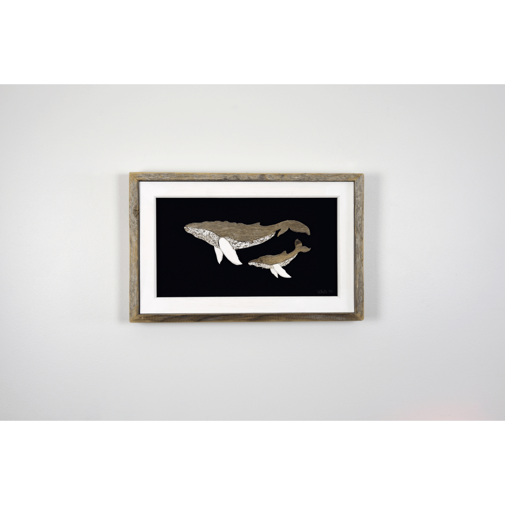 The White's Emporium's "The Mother" driftwood art piece features two humpback whales made from reclaimed wood and driftwood sourced in Newfoundland.