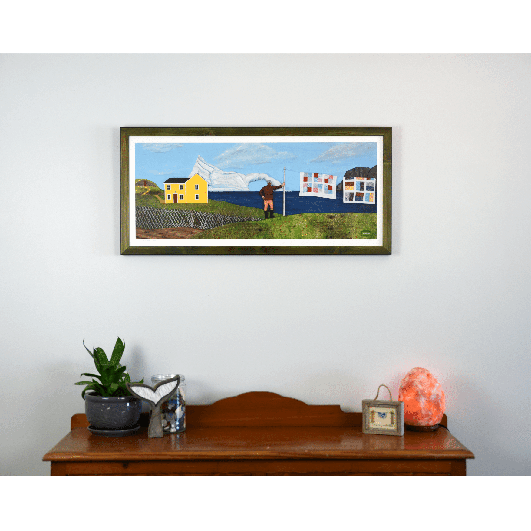 "Living Amongst Giants" print captures a classic Twillingate scene with a man watching an iceberg pass the shores of Newfoundland.
