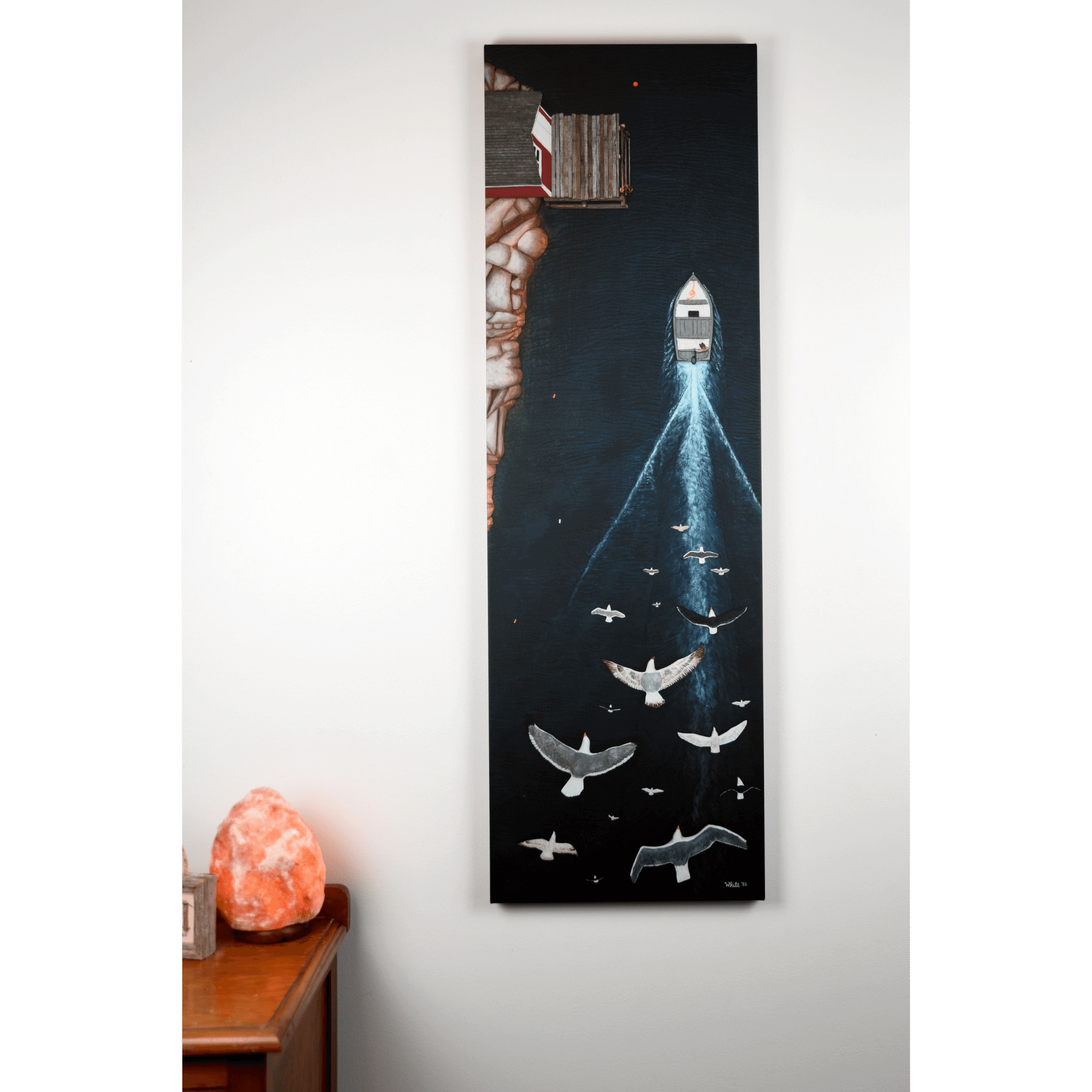 Bring the beauty of Newfoundland's coastline into your home with "Rush Hour" canvas print of a mesmerizing bird's-eye view of a boat sailing through the ocean.