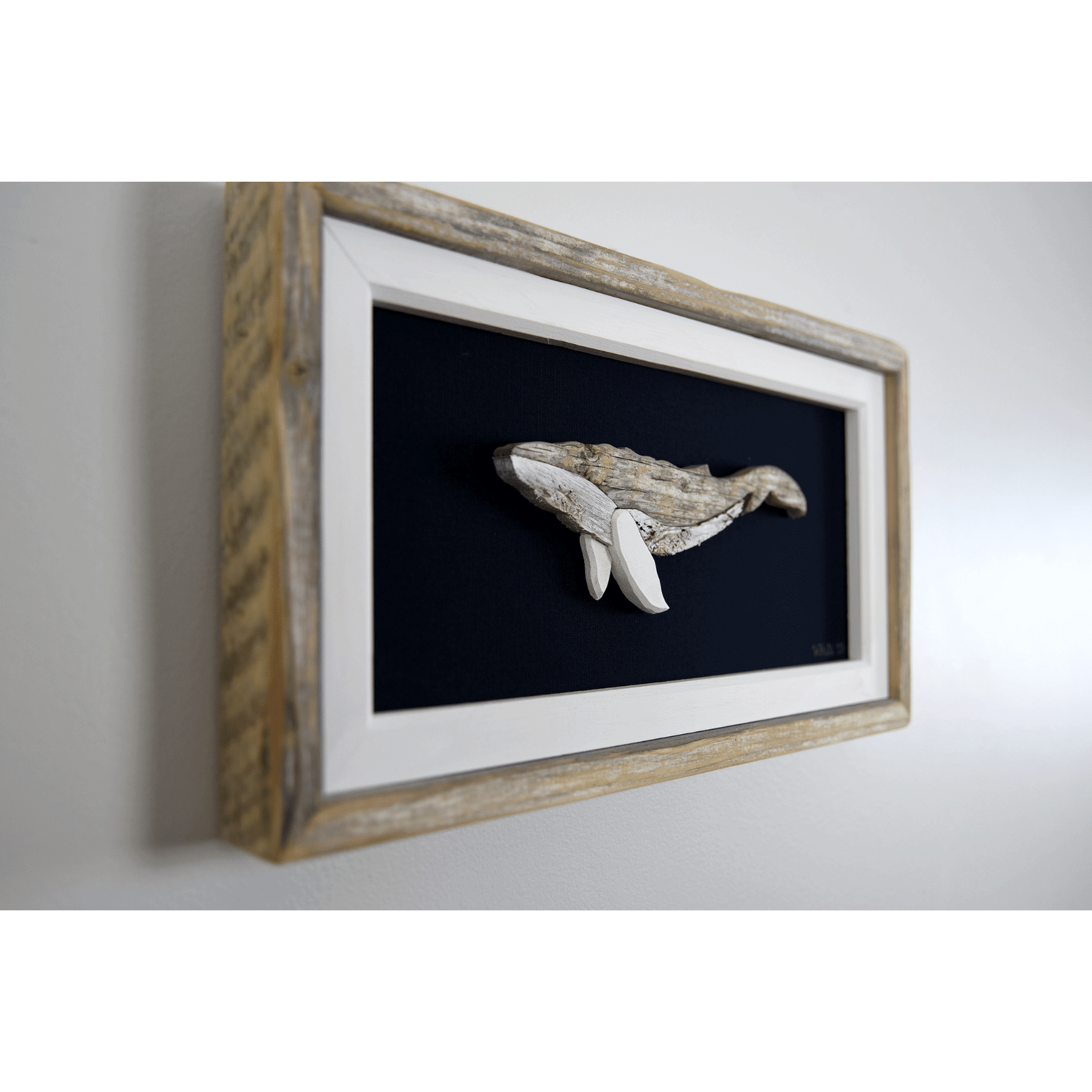 "The Humpback" by The White's Emporium is a mixed media artwork made from various woods and fabric featuring a humpback whale.