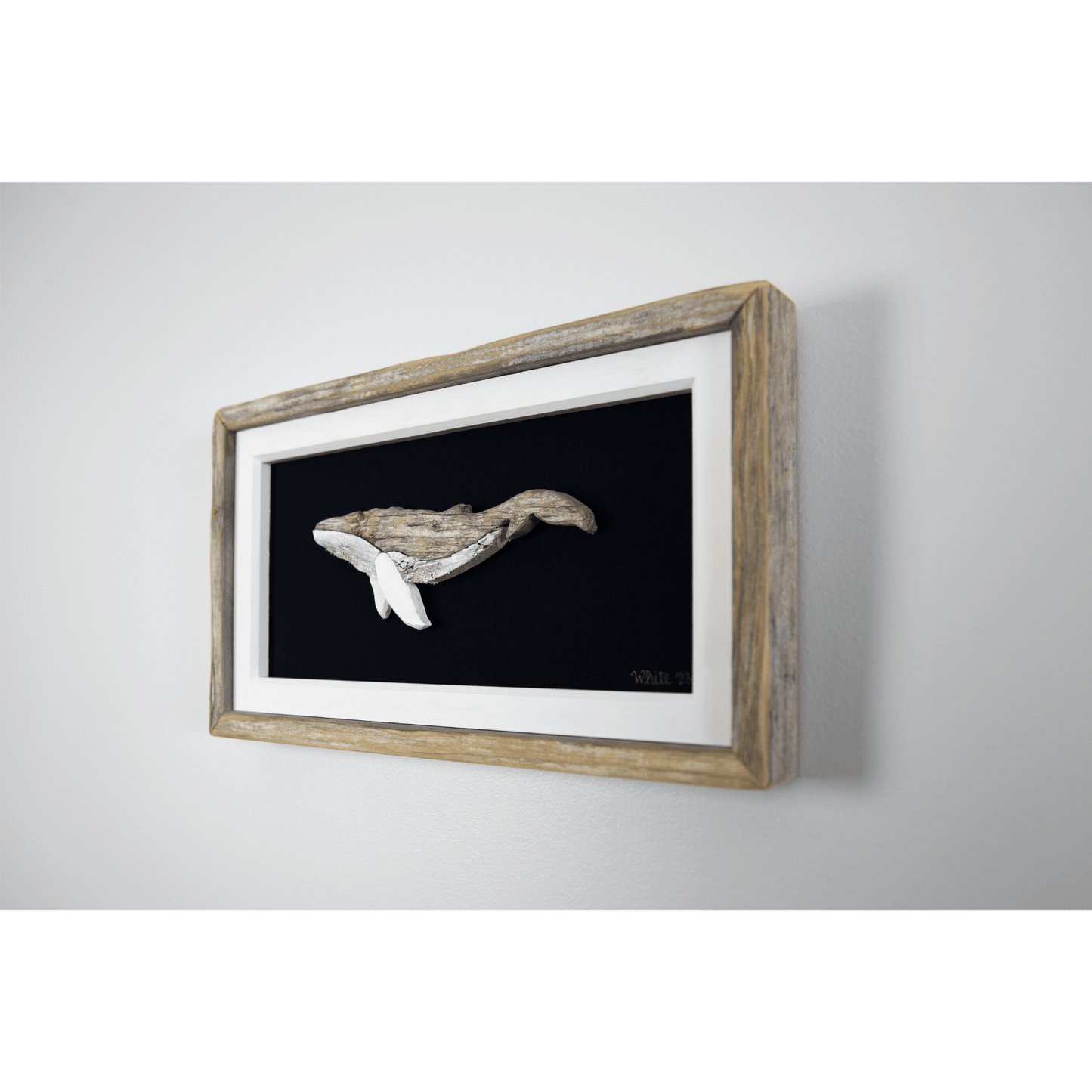 "The Humpback" by The White's Emporium is a mixed media artwork made from various woods and fabric featuring a humpback whale.