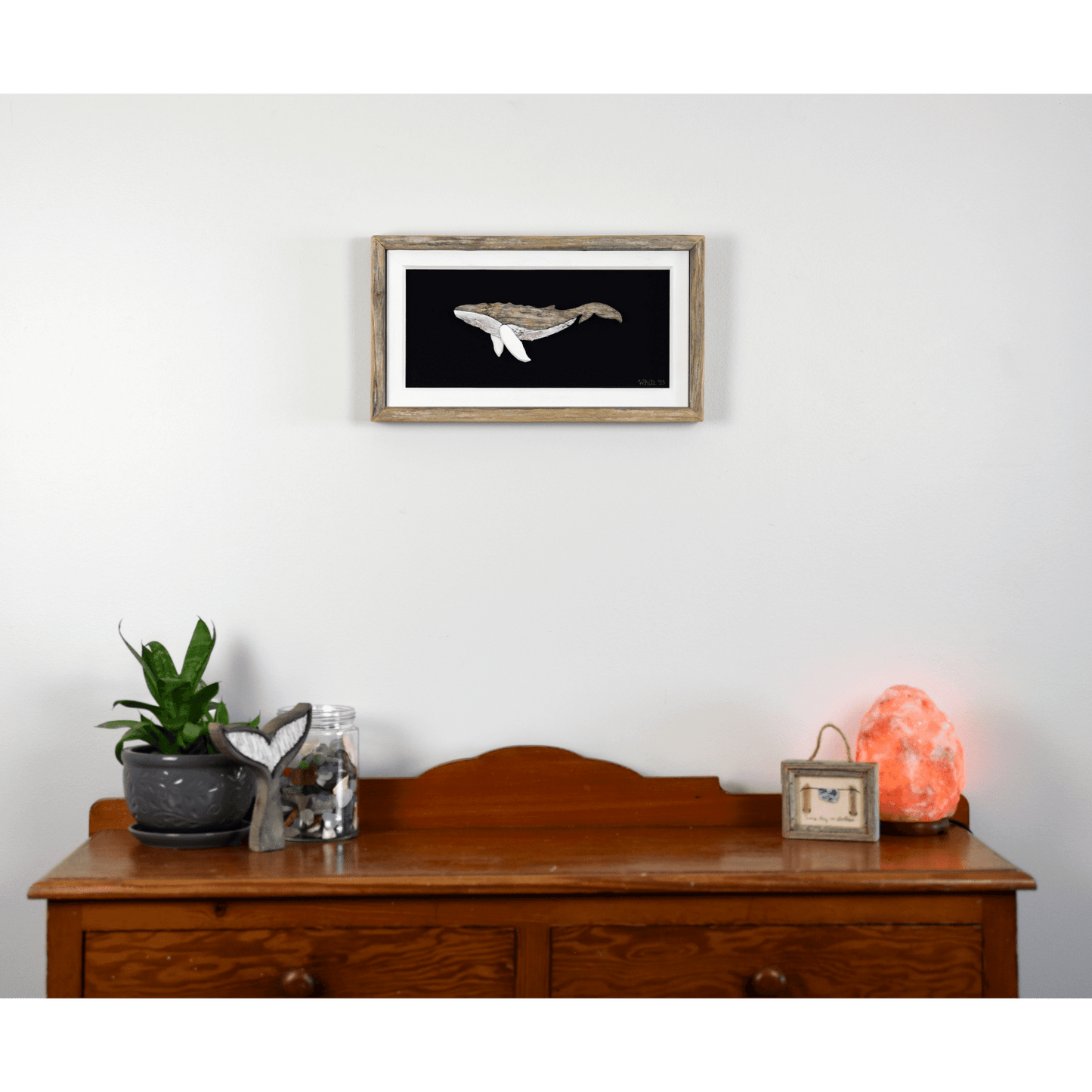 "The Humpback" by The White's Emporium is a mixed media artwork made from various woods and fabric featuring a humpback whale.