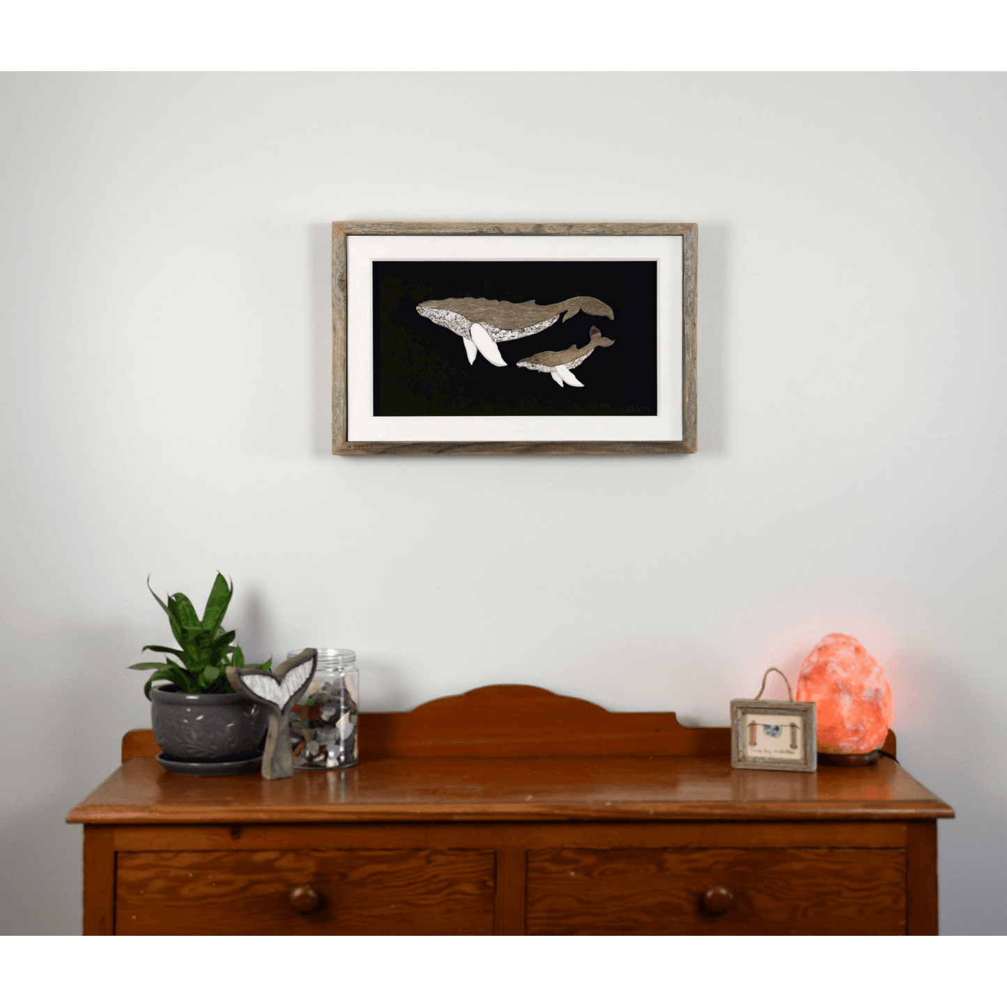 The White's Emporium's "The Mother" driftwood art piece features two humpback whales made from reclaimed wood and driftwood sourced in Newfoundland.