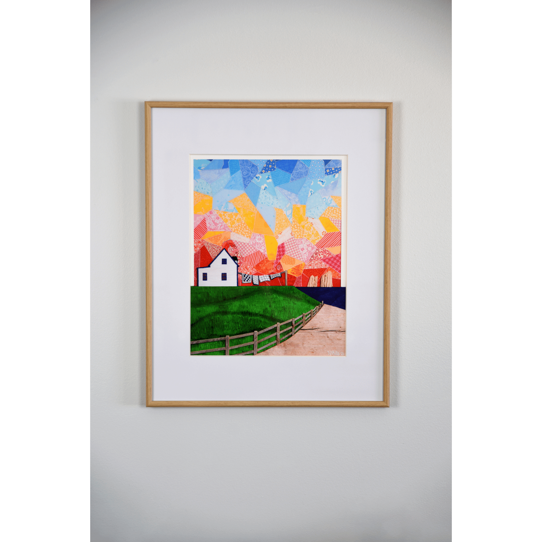 "Twillingate Sunrise" is a serene reproduction print showcasing a house against a patchwork pink and orange sky, with a green lawn and ocean in the foreground.