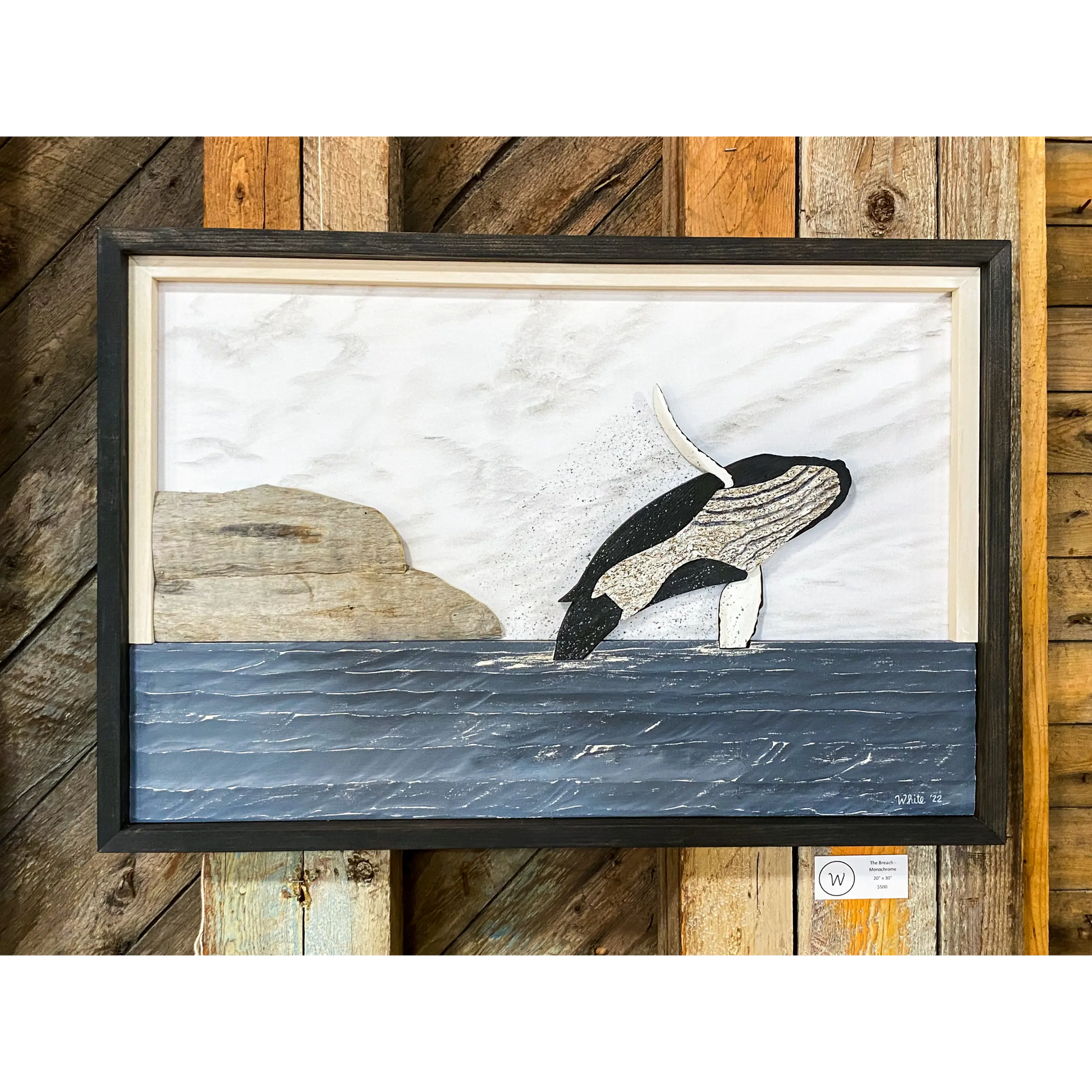 "The Breach- Water Street Series" is a mixed-media artwork of a whale breaching out of the water done in a monochrome scheme.