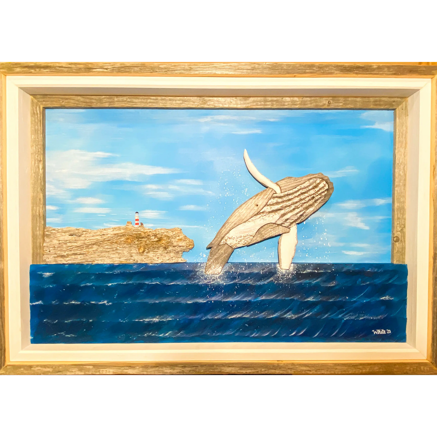 "The Breach" is an original driftwood mixed-media art piece that captures a humpback whale breaching out of the ocean near Newfoundland's shores with a hill and a lighthouse in the background.