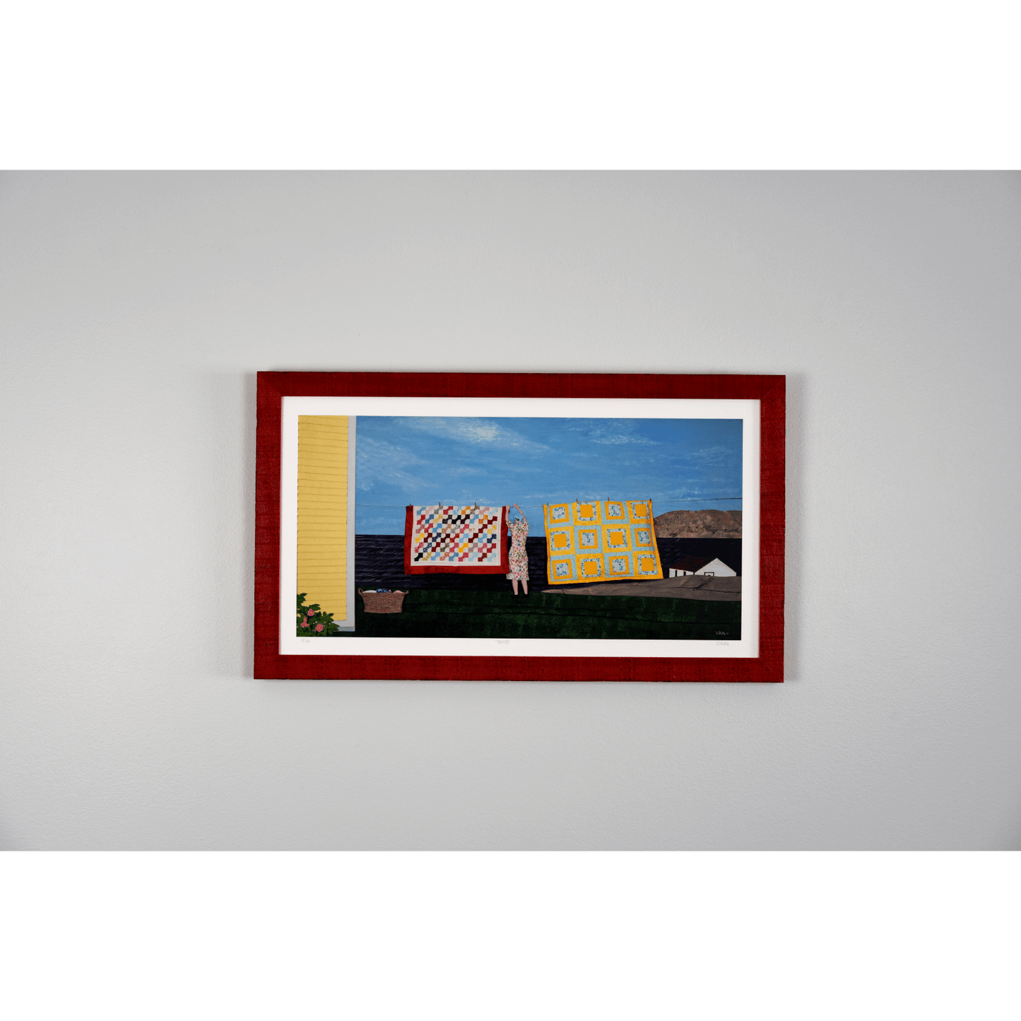 "Quilts" print features a woman in a yellow dress hanging quilts with the ocean and Twillingate coast in the background.