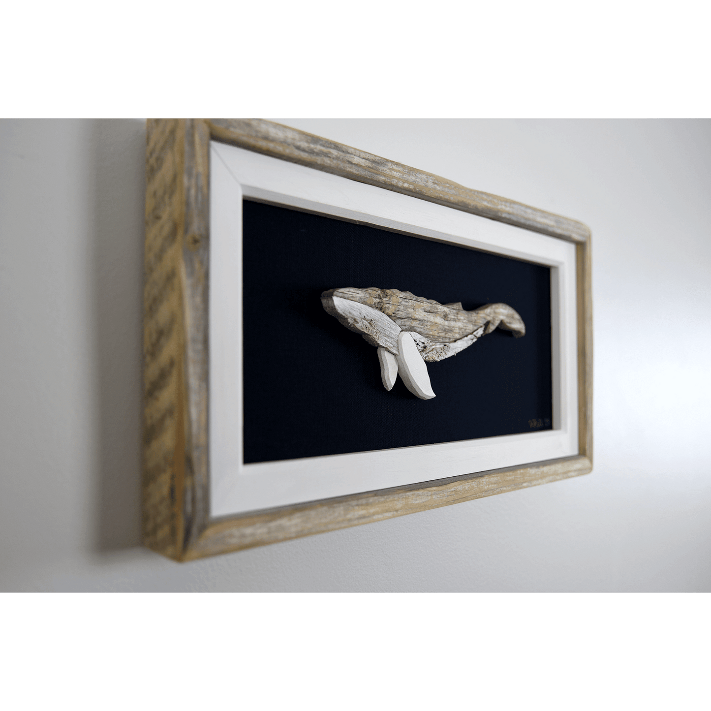   "The Humpback" by The White's Emporium is a mixed media artwork made from various woods and fabric featuring a humpback whale. 